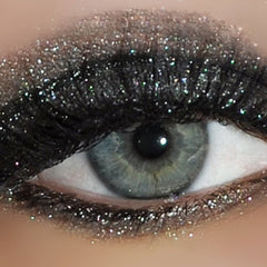 Side view of Dollipop Eye Shadow Sampler Pack displaying six vibrant powder shades in round pans with glossy black packaging