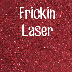 Small glass jar with black sifter lid containing vibrant laser-cut glitter eyeshadow in assorted colors