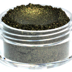 Side view of black mineral eyeshadow with gold shimmer in compact, showcasing vegan formula texture