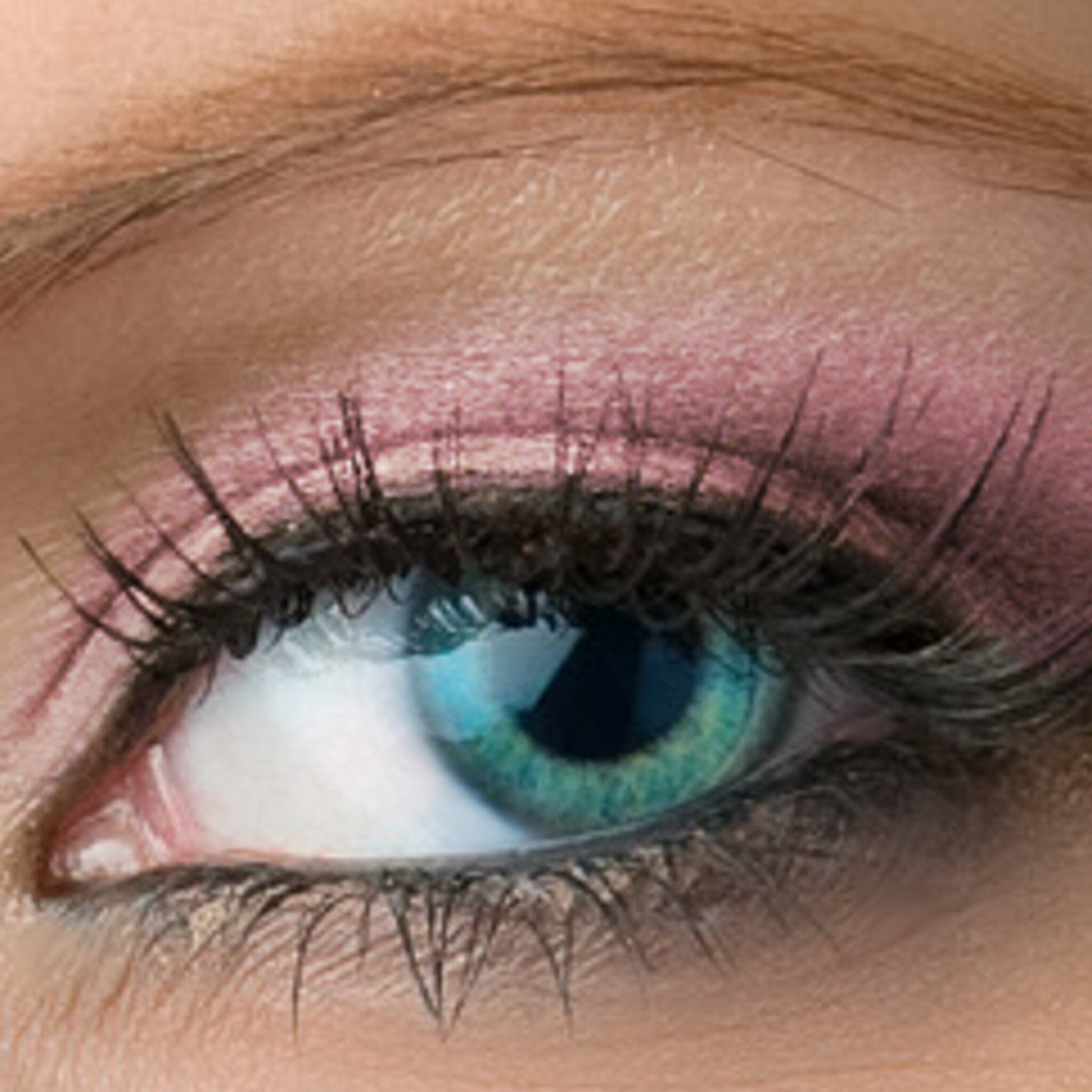 Side view of Pixie Vegan Mineral Eyeshadow in Rose with Pink & Turquoise Shimmer, showing compact size and reflective finish