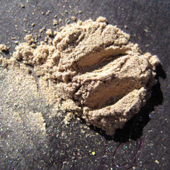 Loose mineral eyeshadow in sheer tan with taupe beige base and gold-green pearl shimmer, vegan silk finish