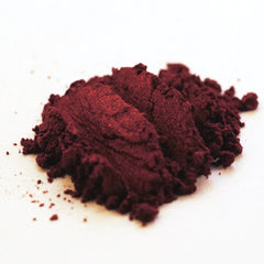 Close-up of blood red metallic loose mineral eyeshadow with intense shimmer and vampy finish
