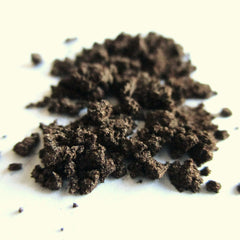 Close-up of vegan mocha mineral eye shadow showing rich brown powder texture in compact