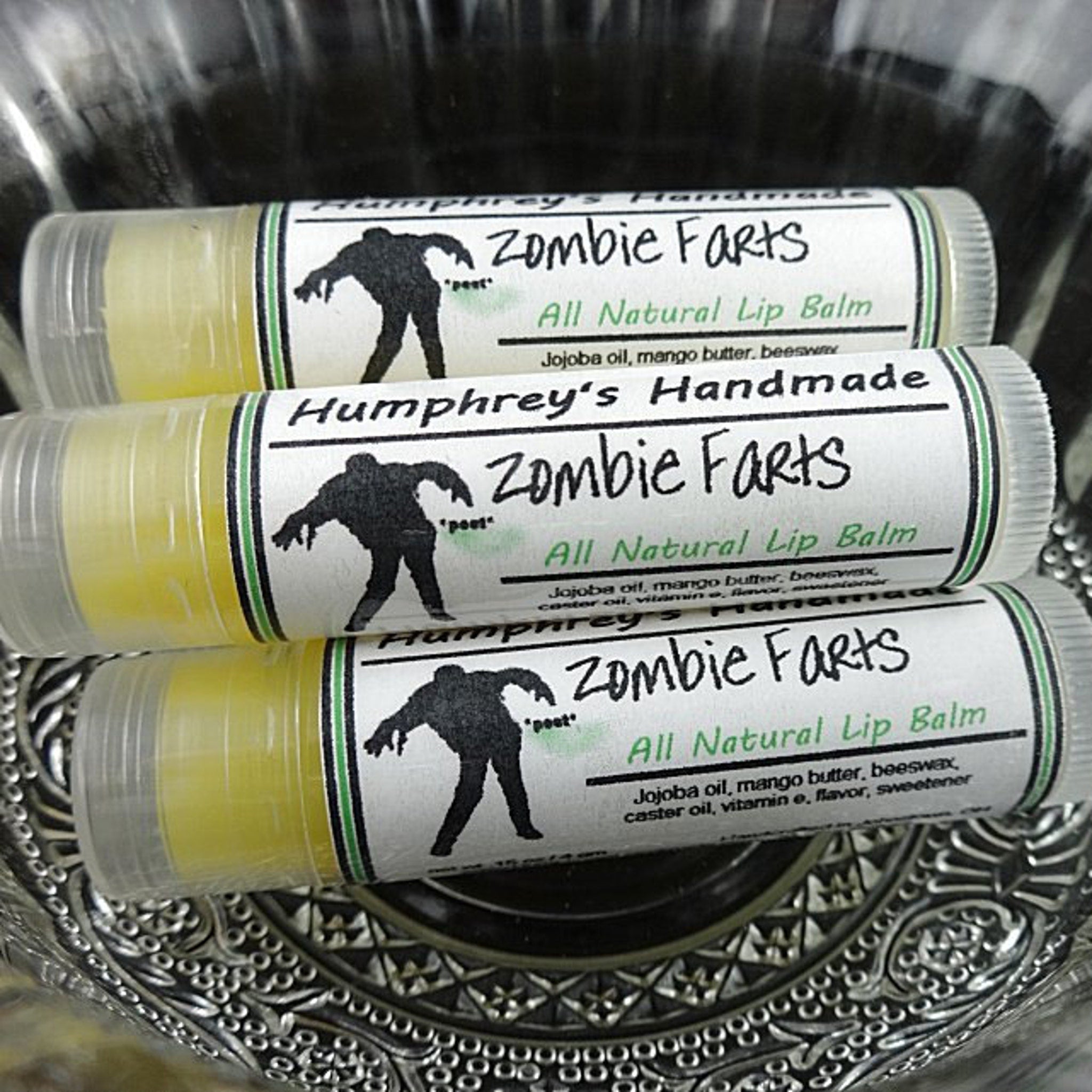 Lip balm tubes with yellow balm, clear plastic, and Humphrey's Handmade labels