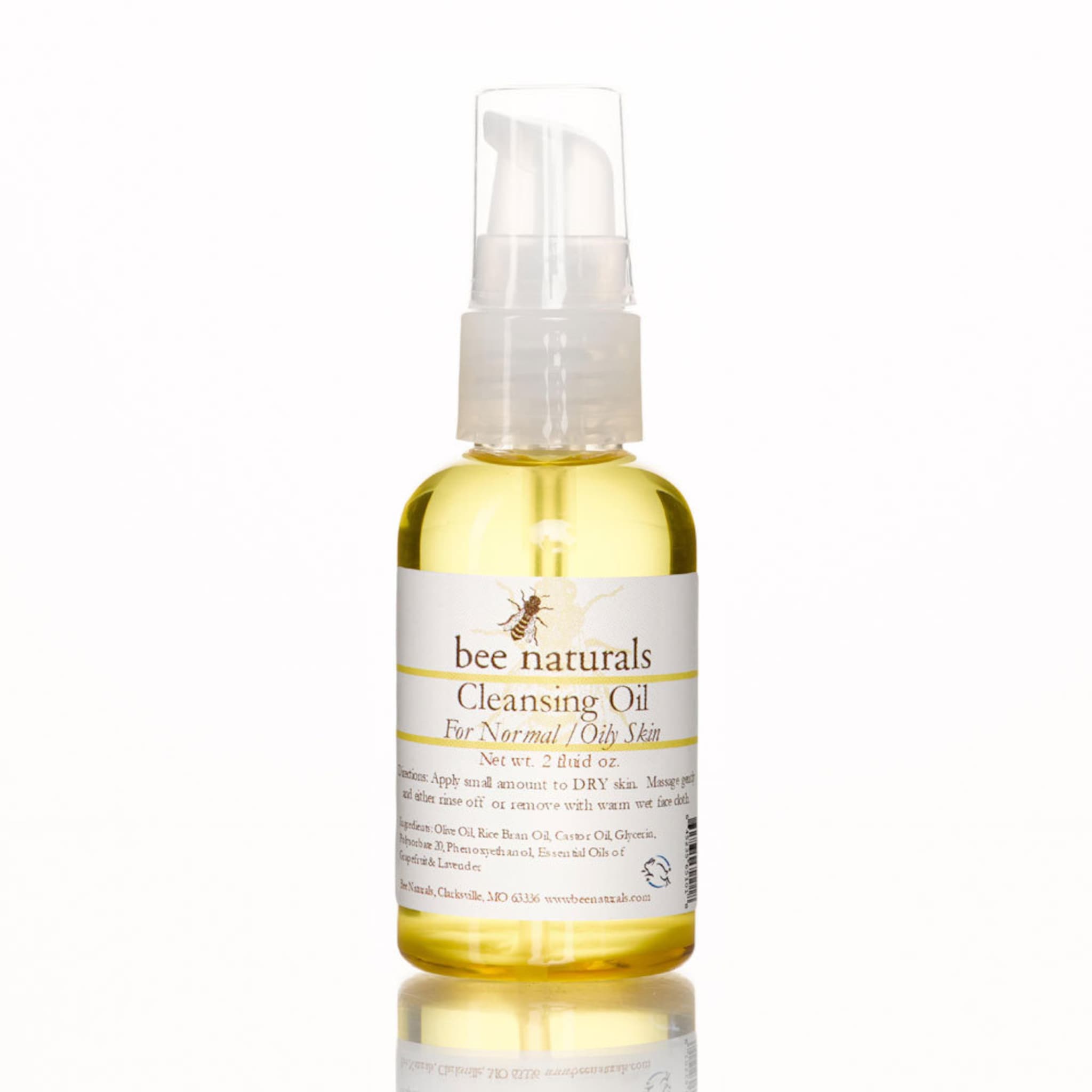 Cleansing Oil bottle with yellow liquid, white label, and clear pump top, Bee Naturals brand