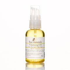 Cleansing Oil bottle with yellow liquid, white label, and clear pump top, Bee Naturals brand