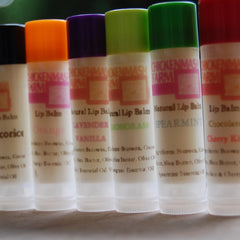 Lip balm tubes with various colored caps, Chickenmash Farm branding visible, for lip care
