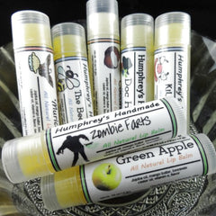 Lip balm tubes with white labels, green accents, and Humphrey's Handmade text, various flavors visible