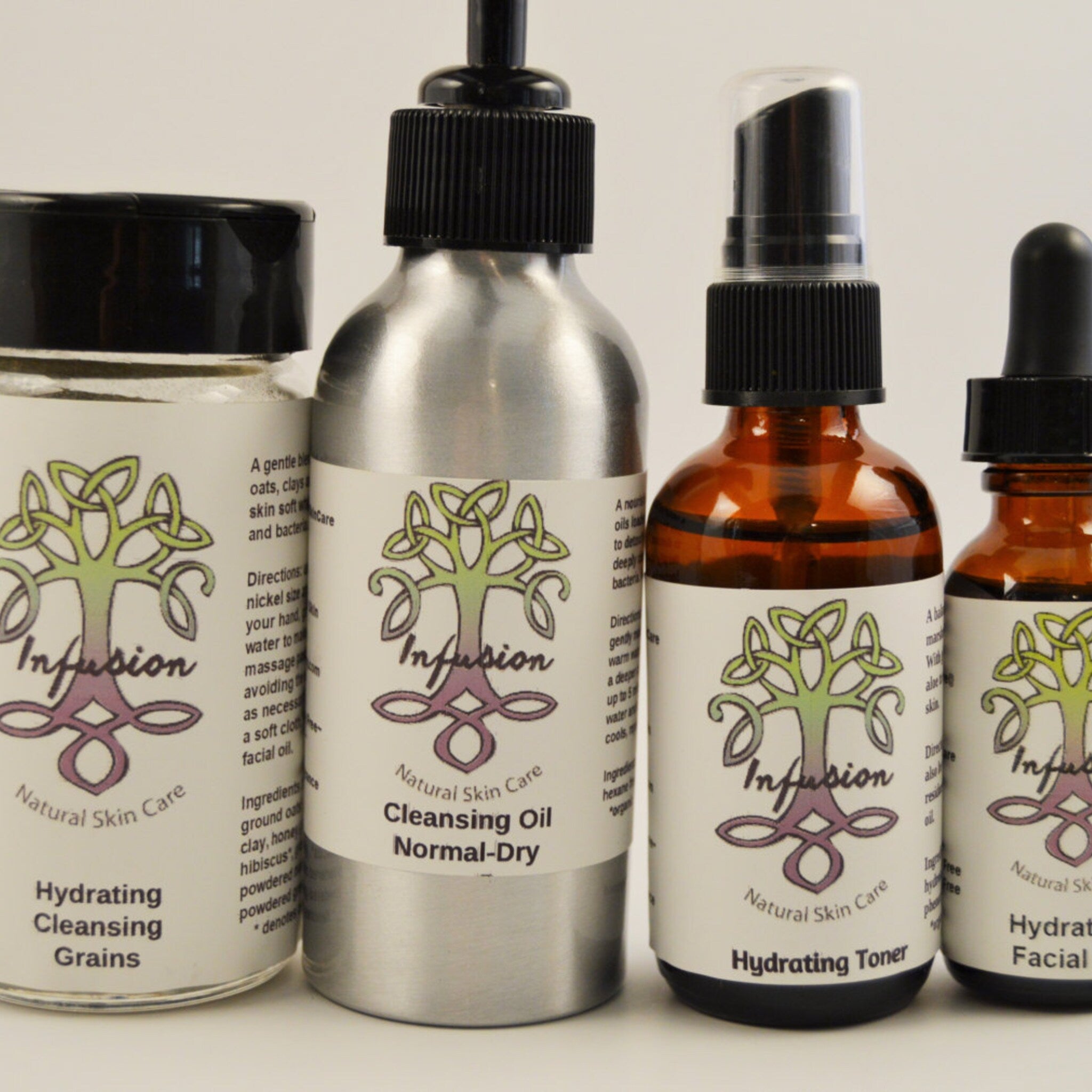 Skin care products in various bottles with black caps, brown and silver containers, "Infusion" label
