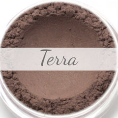 Terra vegan mineral eyeshadow pot in deep brown with subtle shimmer, showcasing smooth powder texture and compact size.