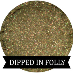 Close-up of olive gold eyeshadow pan with metallic finish for fall Halloween looks