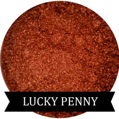 Copper eye shadow makeup with speckled texture, metallic sheen, and LUCKY PENNY brand text