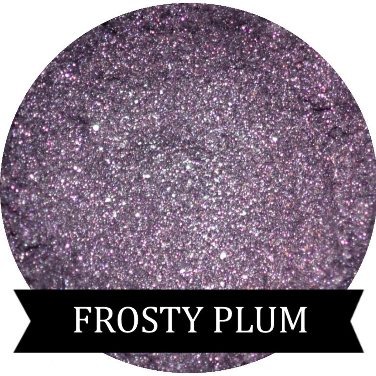 Close-up of shimmery frosty plum purple eyeshadow in a compact pan with reflective metallic finish