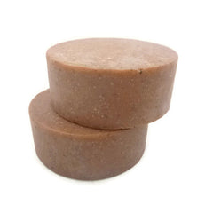 Round soap bars, brown color, stacked, textured surface