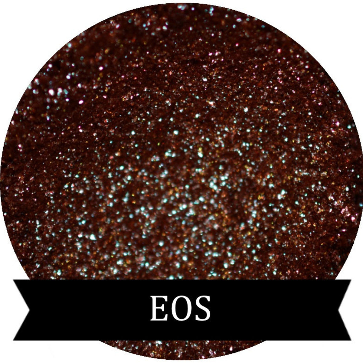 Close-up of duochrome eyeshadow pigment pots in brown, red, green, and blue with metallic sheen