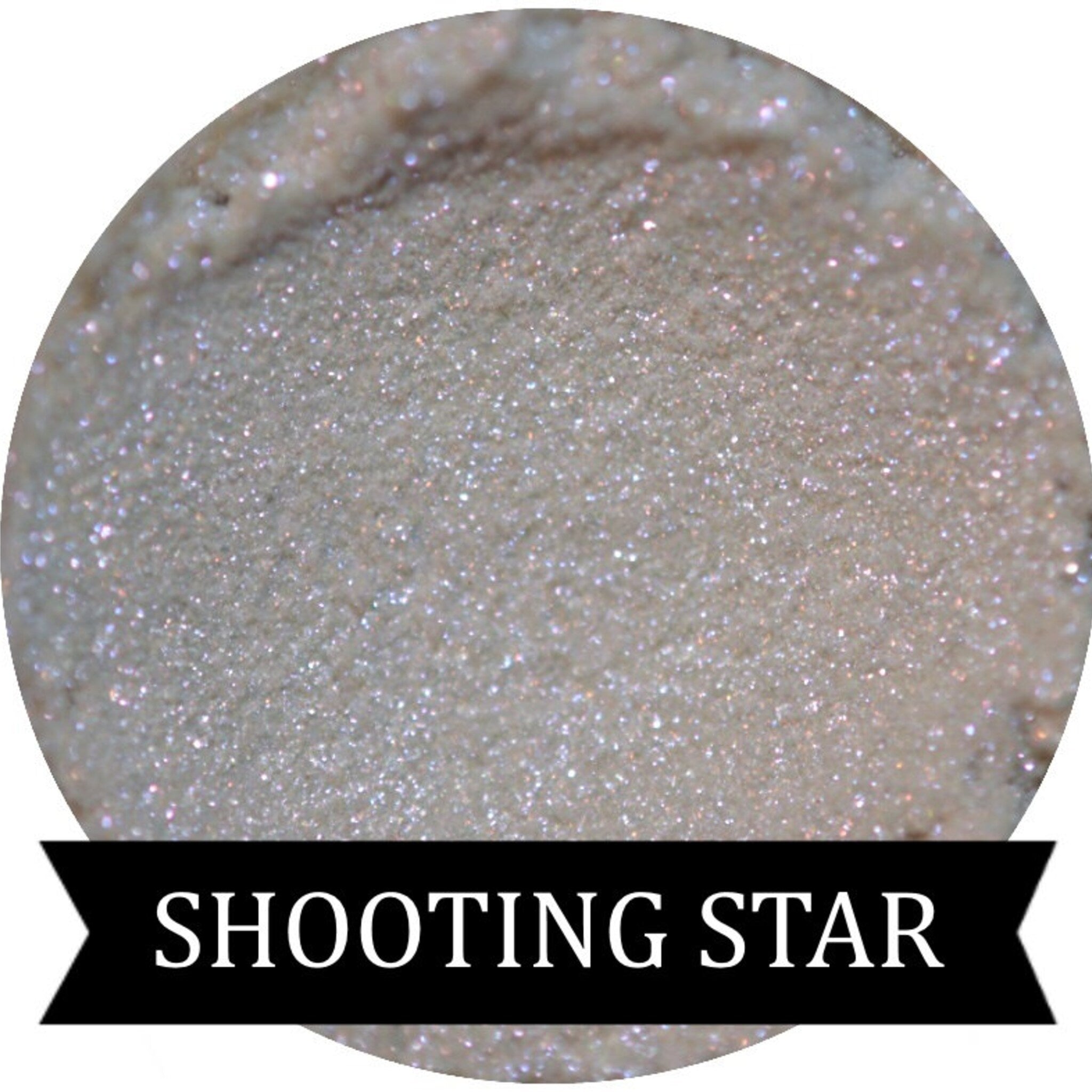 Close-up of Shooting Star iridescent purple eyeshadow with shimmer particles in compact case