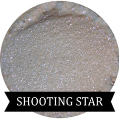 Close-up of Shooting Star iridescent purple eyeshadow with shimmer particles in compact case