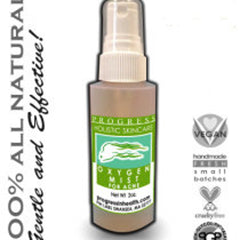 Oxygen mist bottle with white spray top, green and white label, and "Progress" text