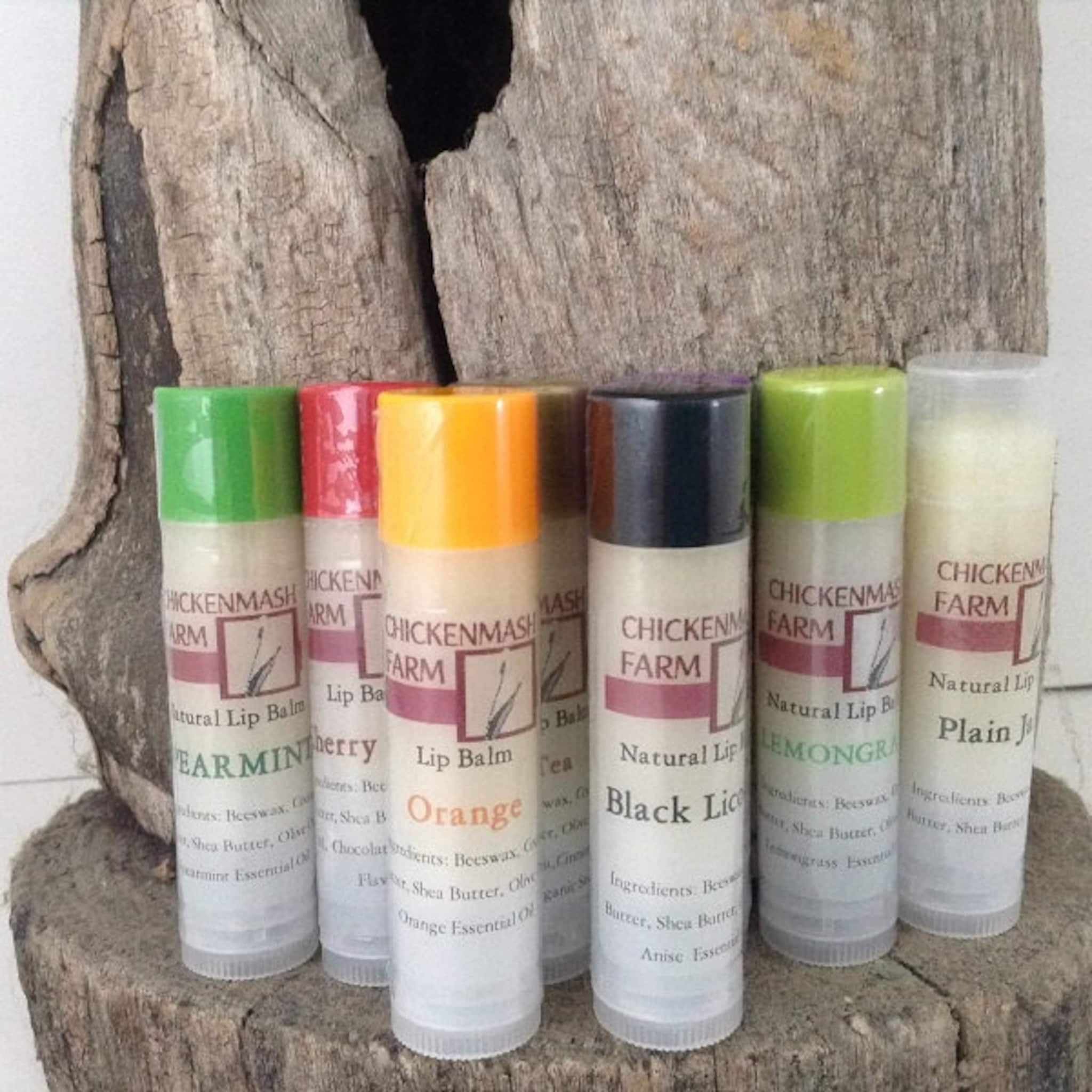 Lip balms with colorful caps, Chickenmash Farm brand, on wood display