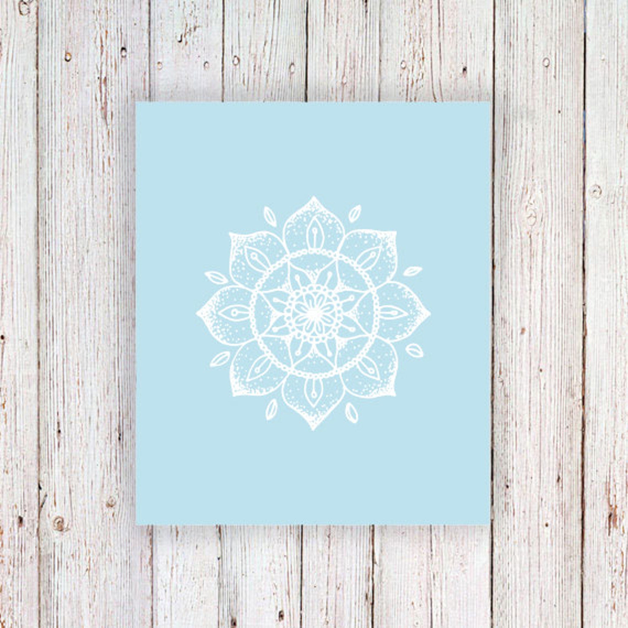 White henna tattoo kit with delicate mandala stencils and skin-safe applicator on boho-inspired packaging